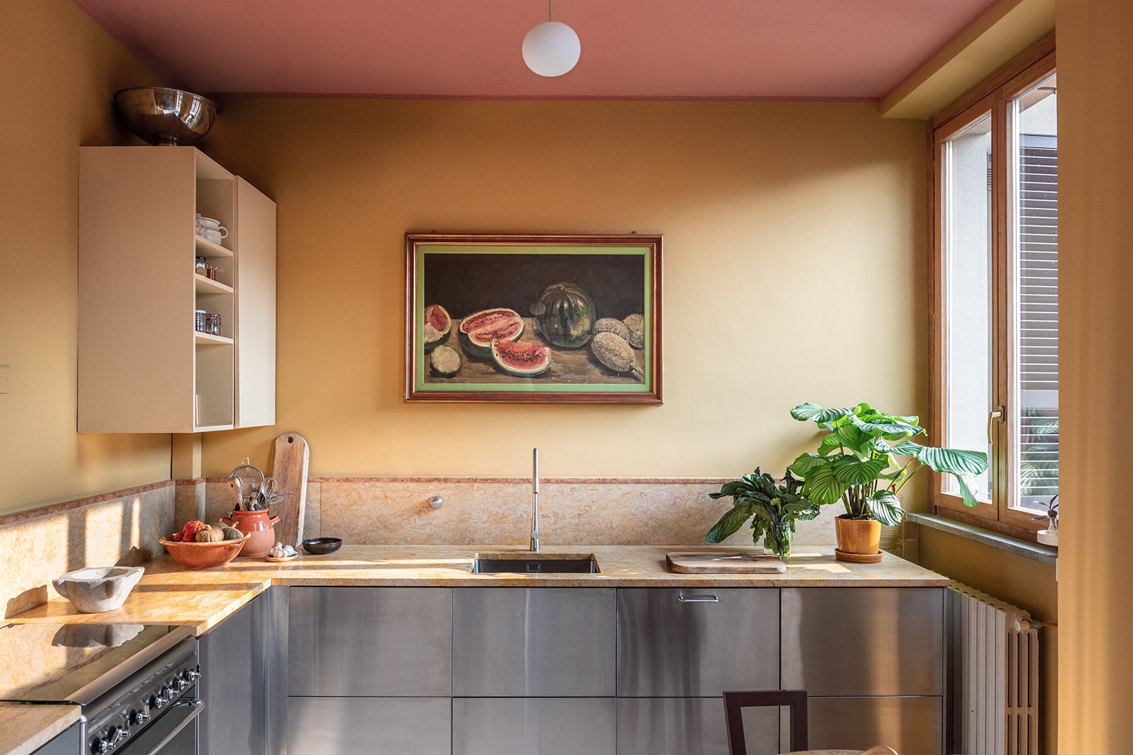 peach kitchen with stainless-steel cabinets