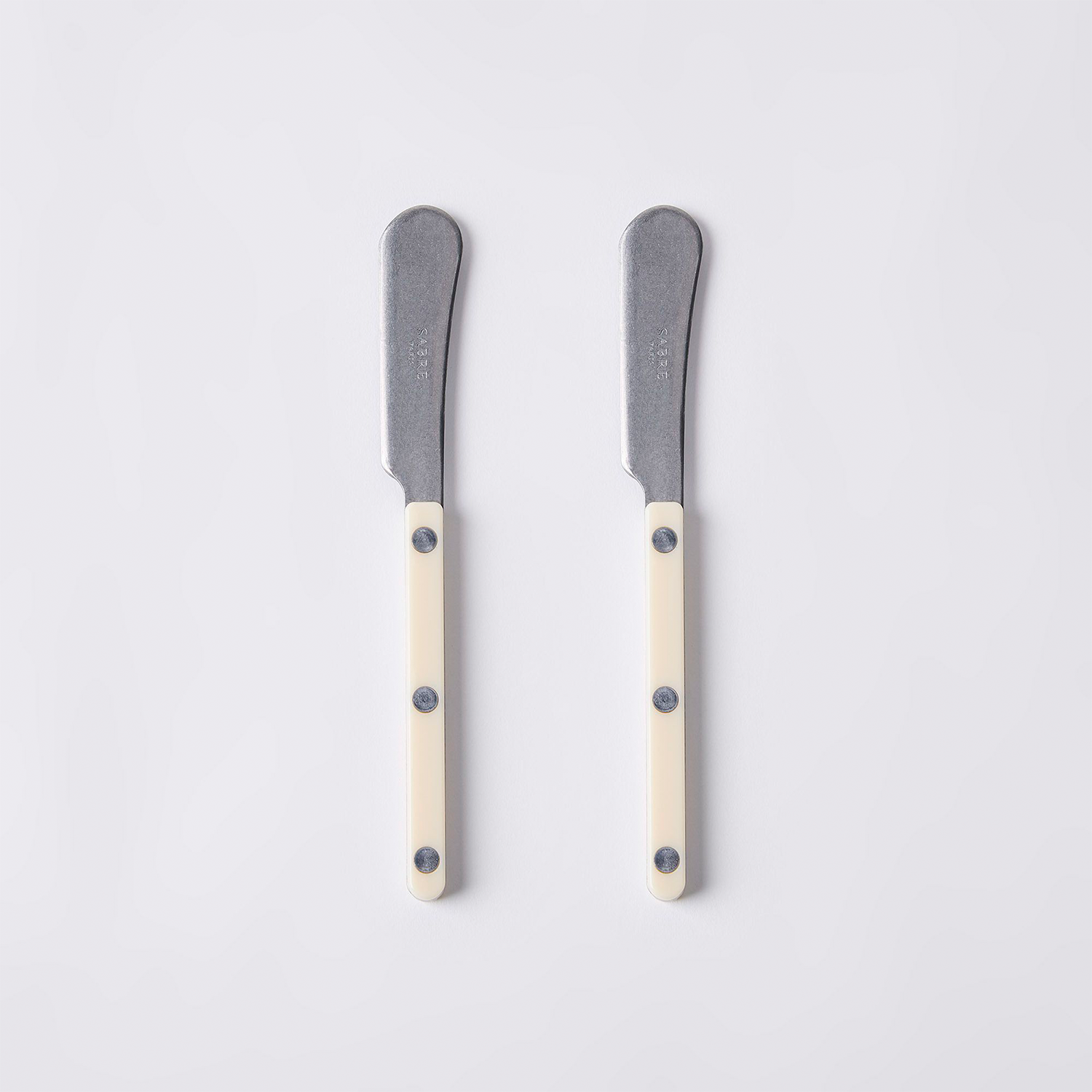 two ivory butter knives