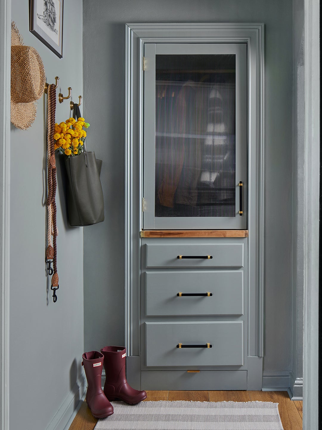 pale blue entryway with faux built-in storage