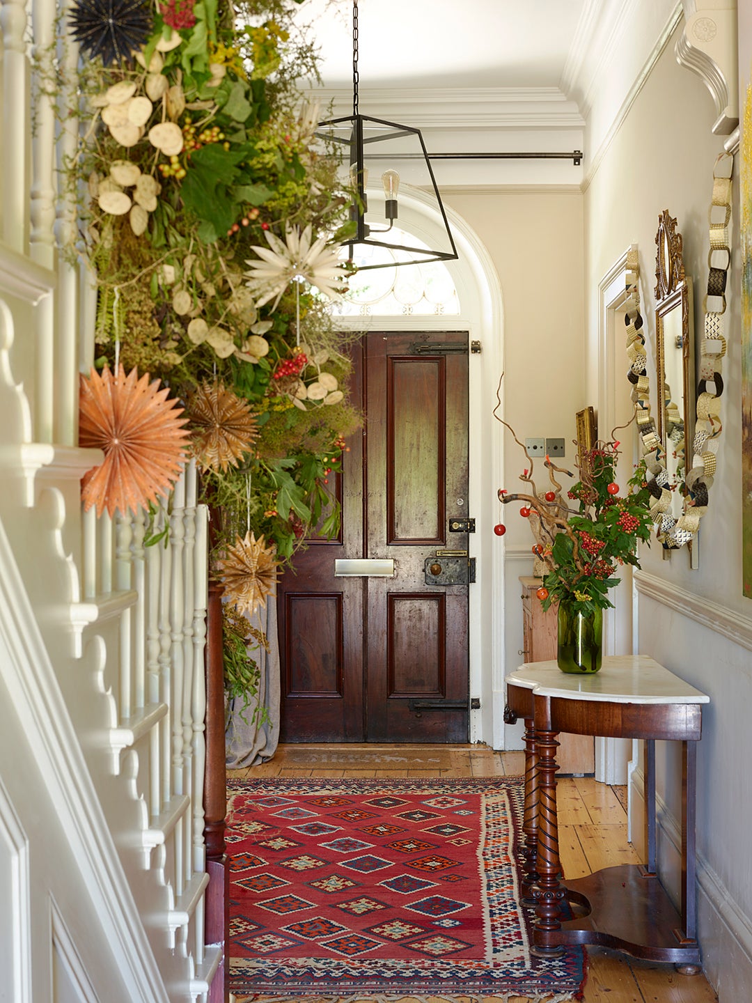 Entryway with arrangement and garland