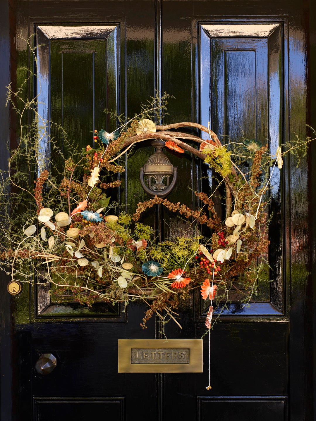 Front door with holiday wreath