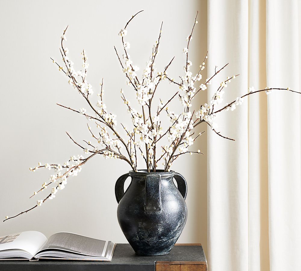 black vase with white flowers