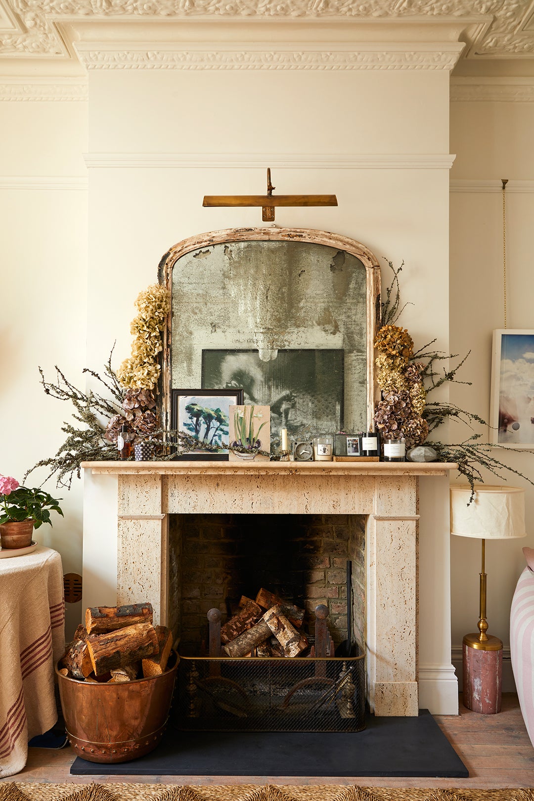 fireplace with antique mirror on mantel