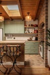 green and brick kitchen