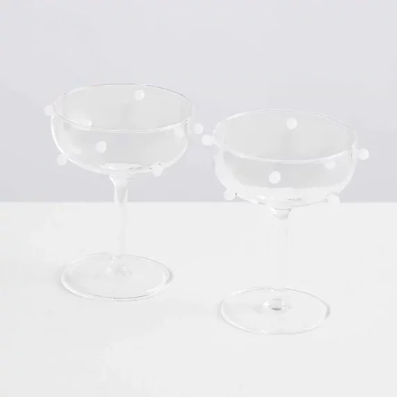 Coupe glasses with white balls
