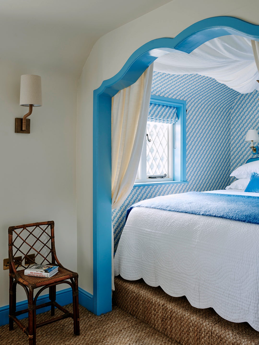 blue scalloped molding around bed