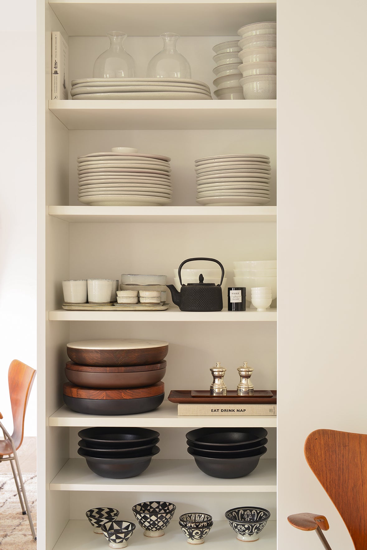 organized dishware in pantry cabinet