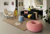 Pink pouf in living room 