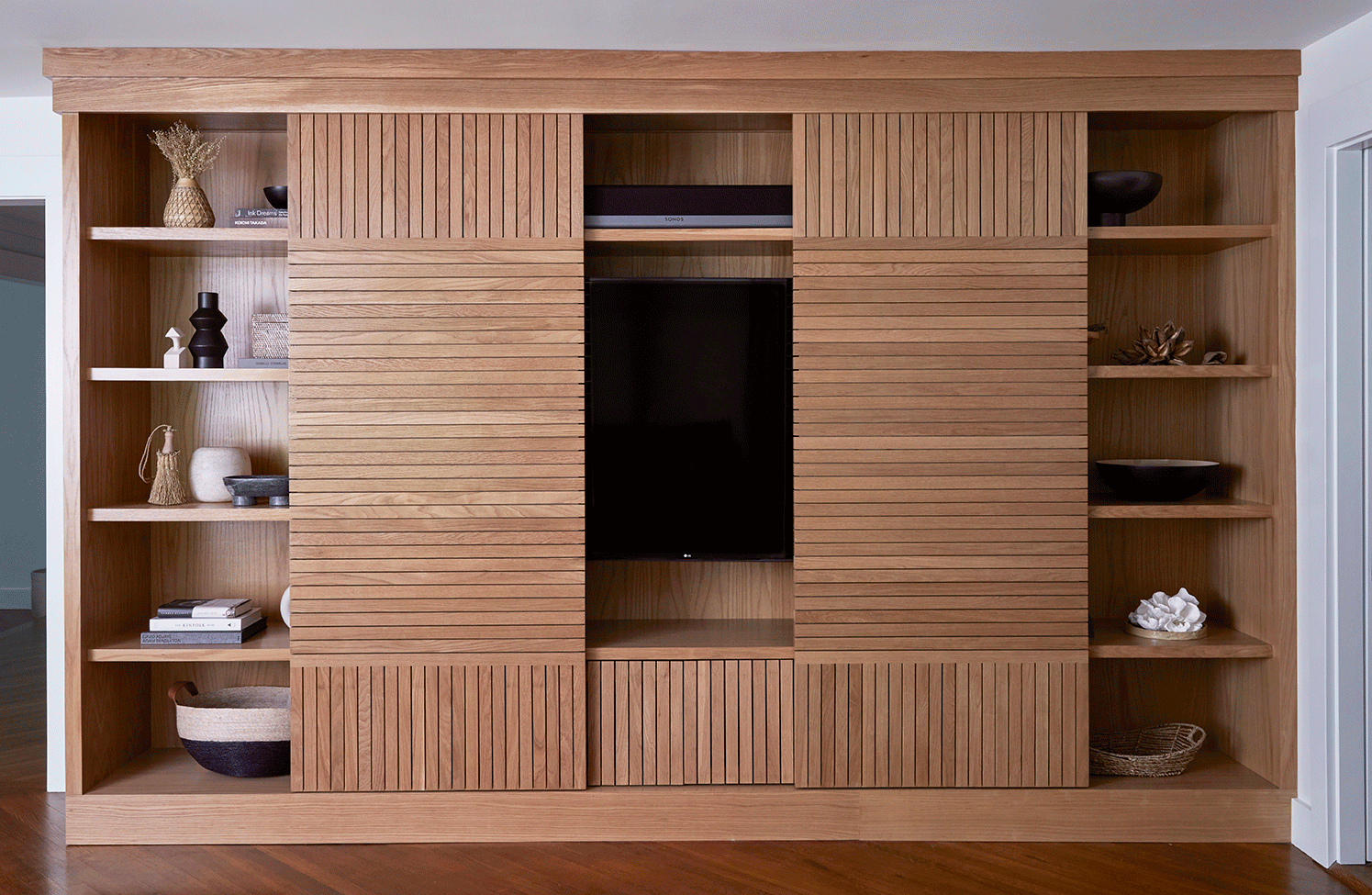 gif of wood slatted cabinet opening