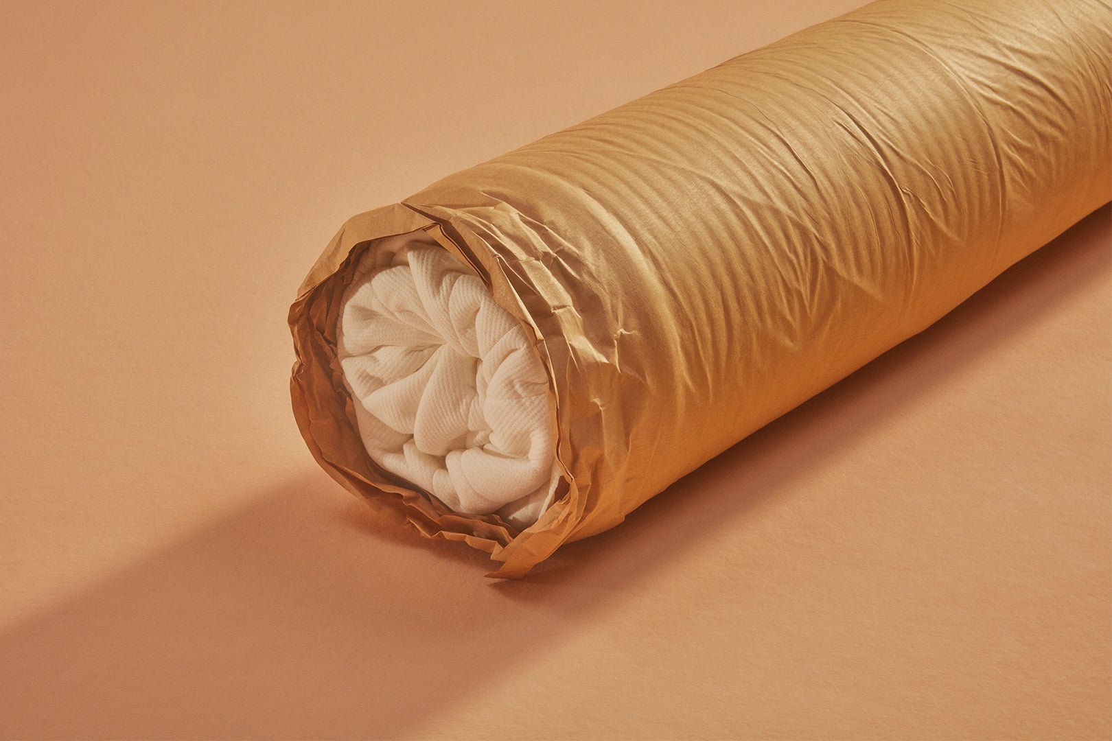 mattress rolled up in packaging