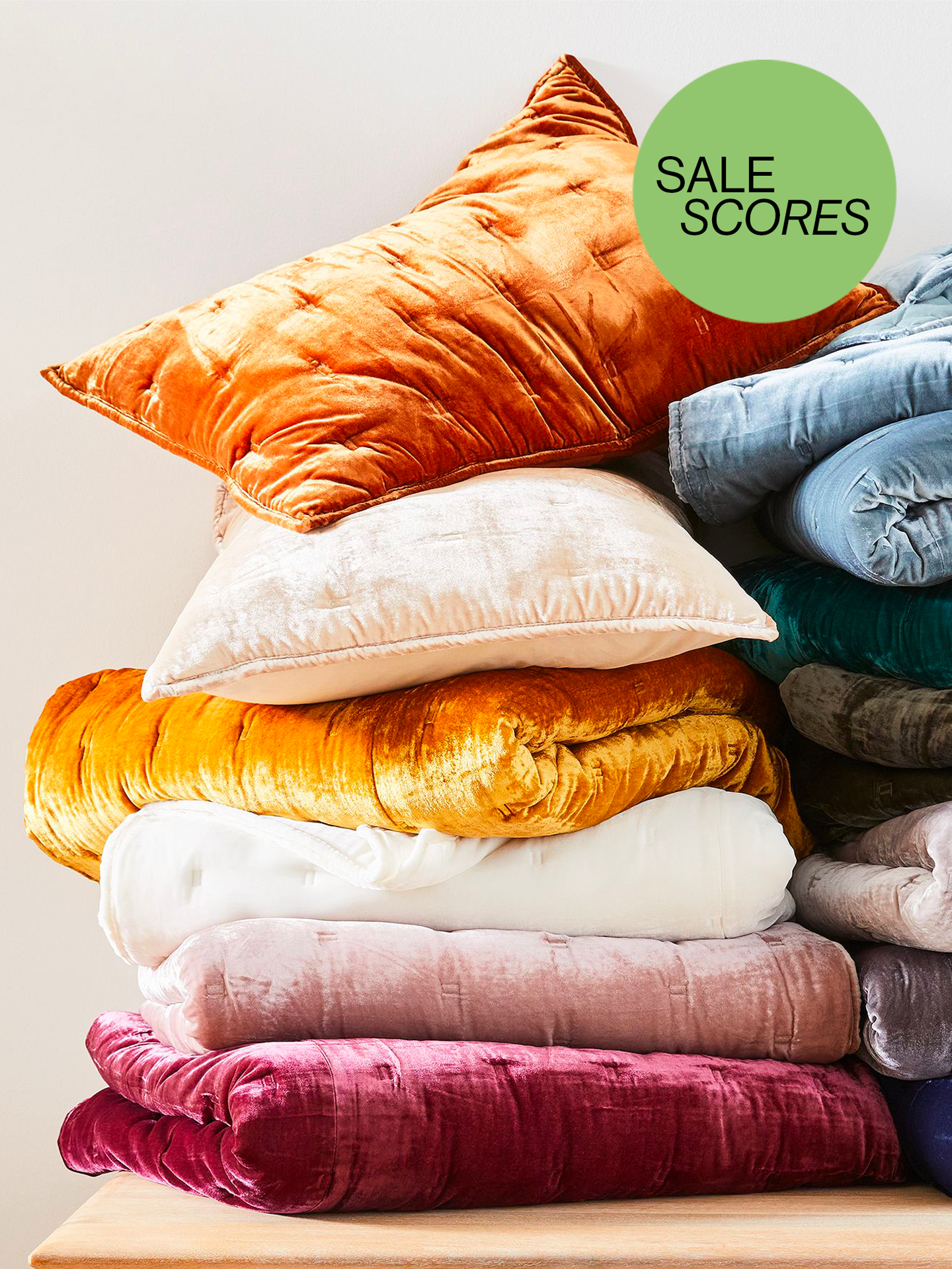 Plush Velvet Quilts and Shams From West Elm in Different, Jewel-Toned Shades Folded Up with Sale Scores Button