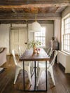 dining room with beams