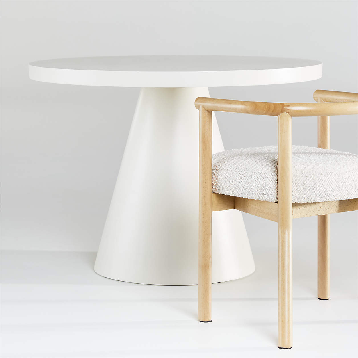 round white play table and wood chair