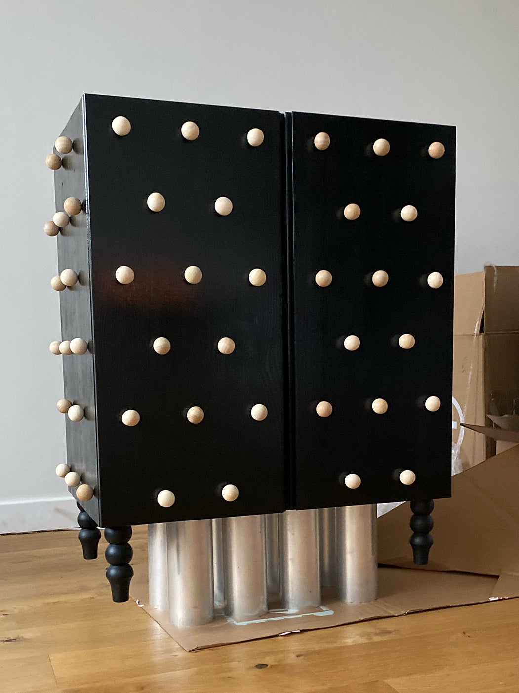 balls attached to cabinet