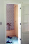 mudroom after with wallpaper and clean floors