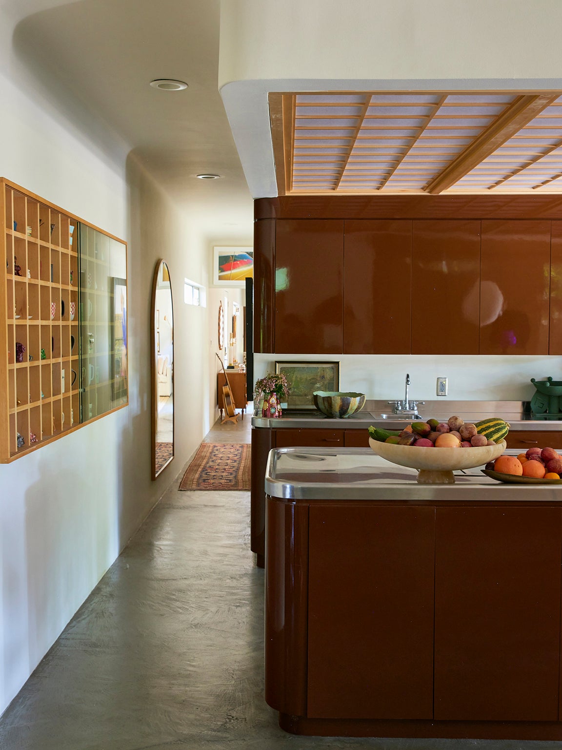 high-gloss brown kitchen cabinets and island