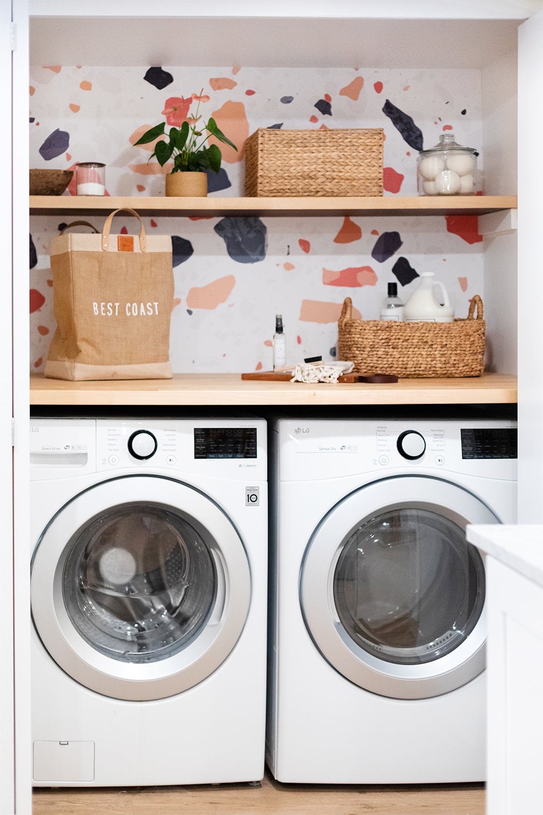 Laundry nook with terrazzo wallpaper