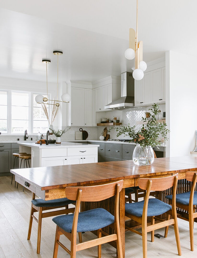 white kitchen with blue chairs