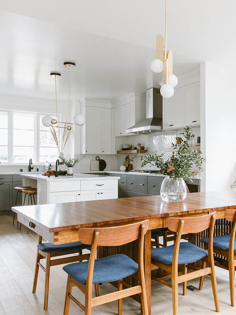 white kitchen with blue chairs