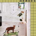 marble bathroom with freestanding storage and cat