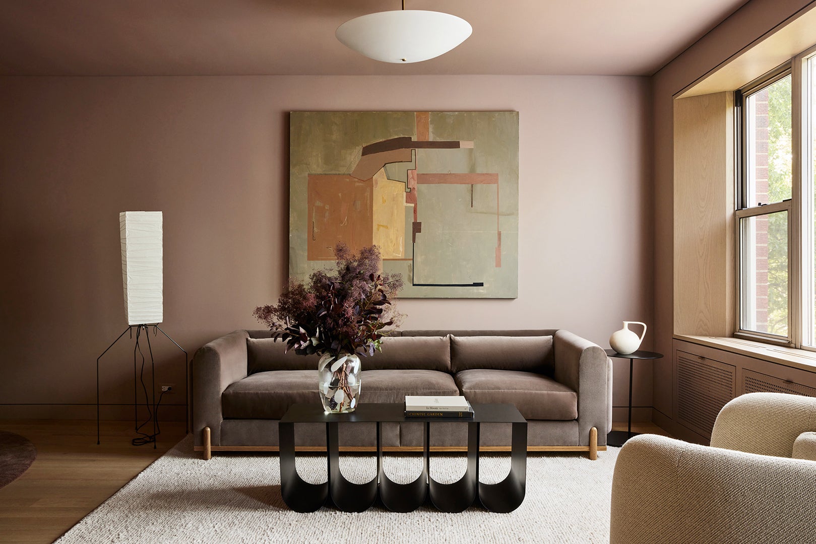 living room with black coffee table and custom sofa 