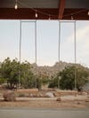 wood swings hanging from porch ceiling