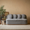 gray sofa with circle back cushions