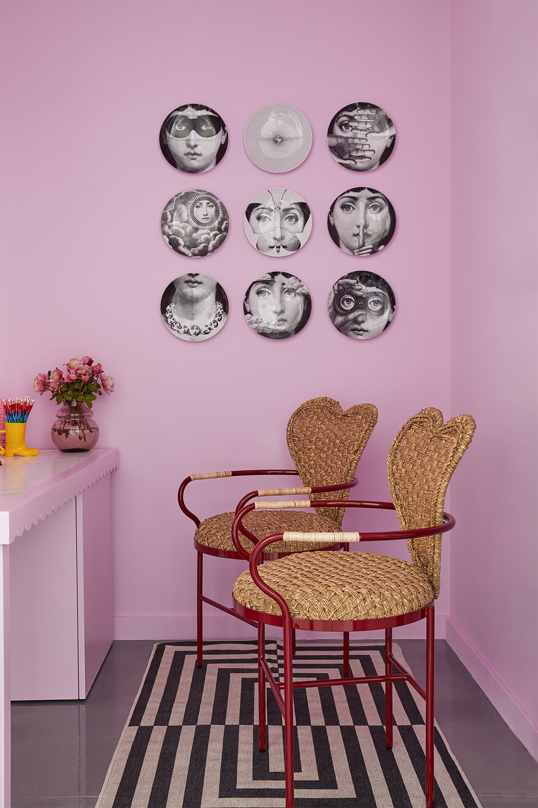 Pink office with heart-shaped wicker chairs