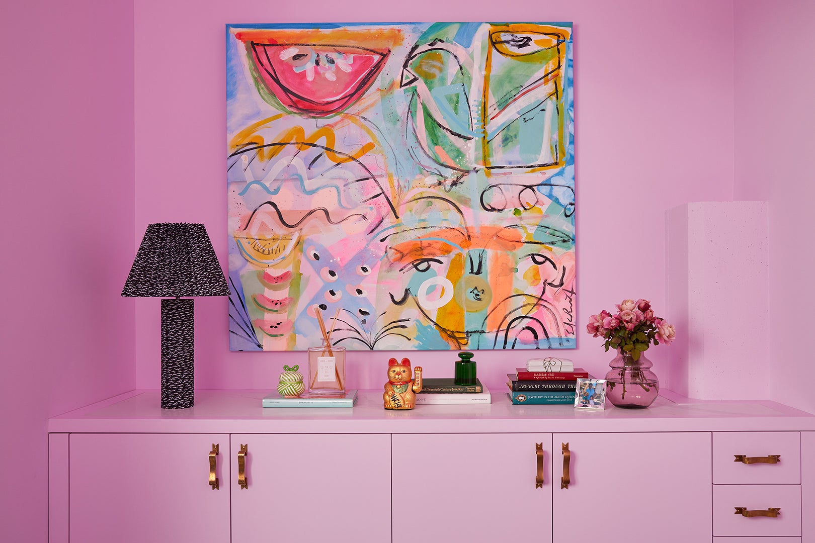 Pink walls with matching pink credenza 