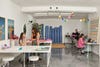 Workspace with colorful mobiles above