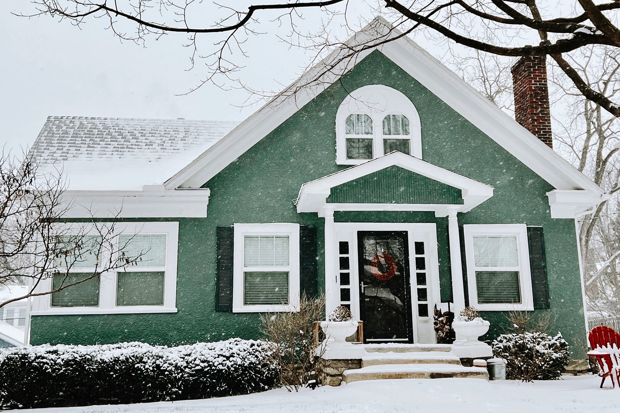 light green house in snow