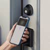 iphone held up to Level smart lock