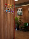 wood paneled wall with colorful coat hook