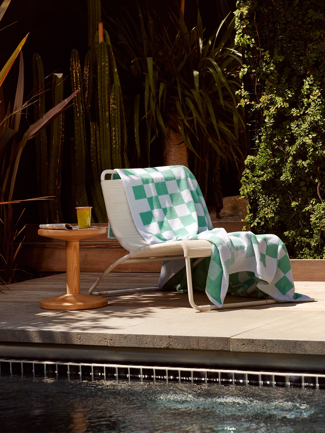 mint checkered towel on lounge chair