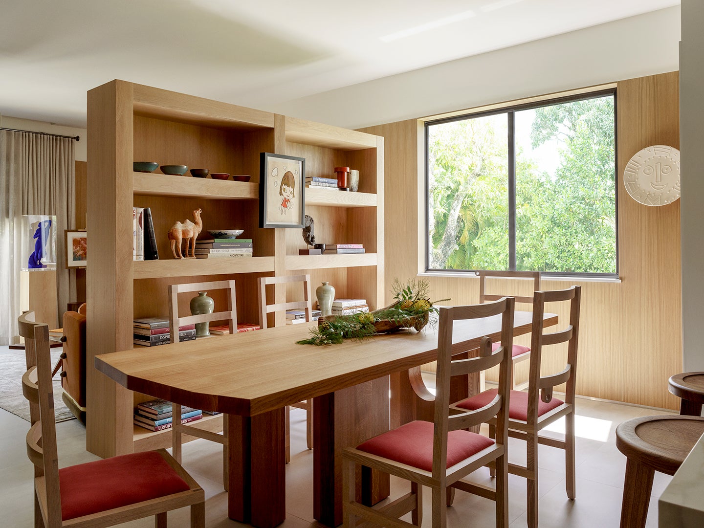 wood dining chairs in front of bookcase