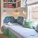 corner of reading nook with curved patterned backboard