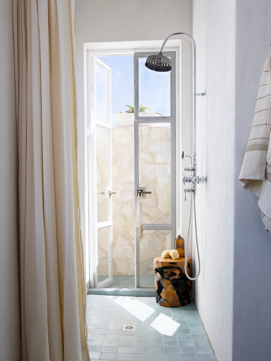 walk-in shower with door to outside