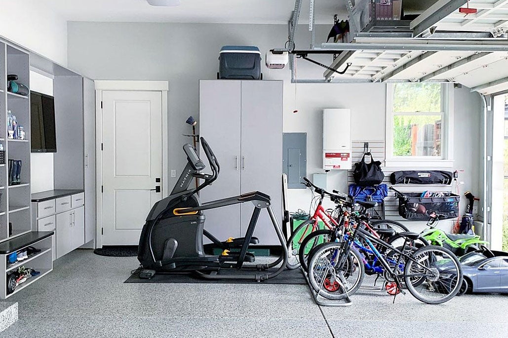 bikes and workout equiptment in a garage
