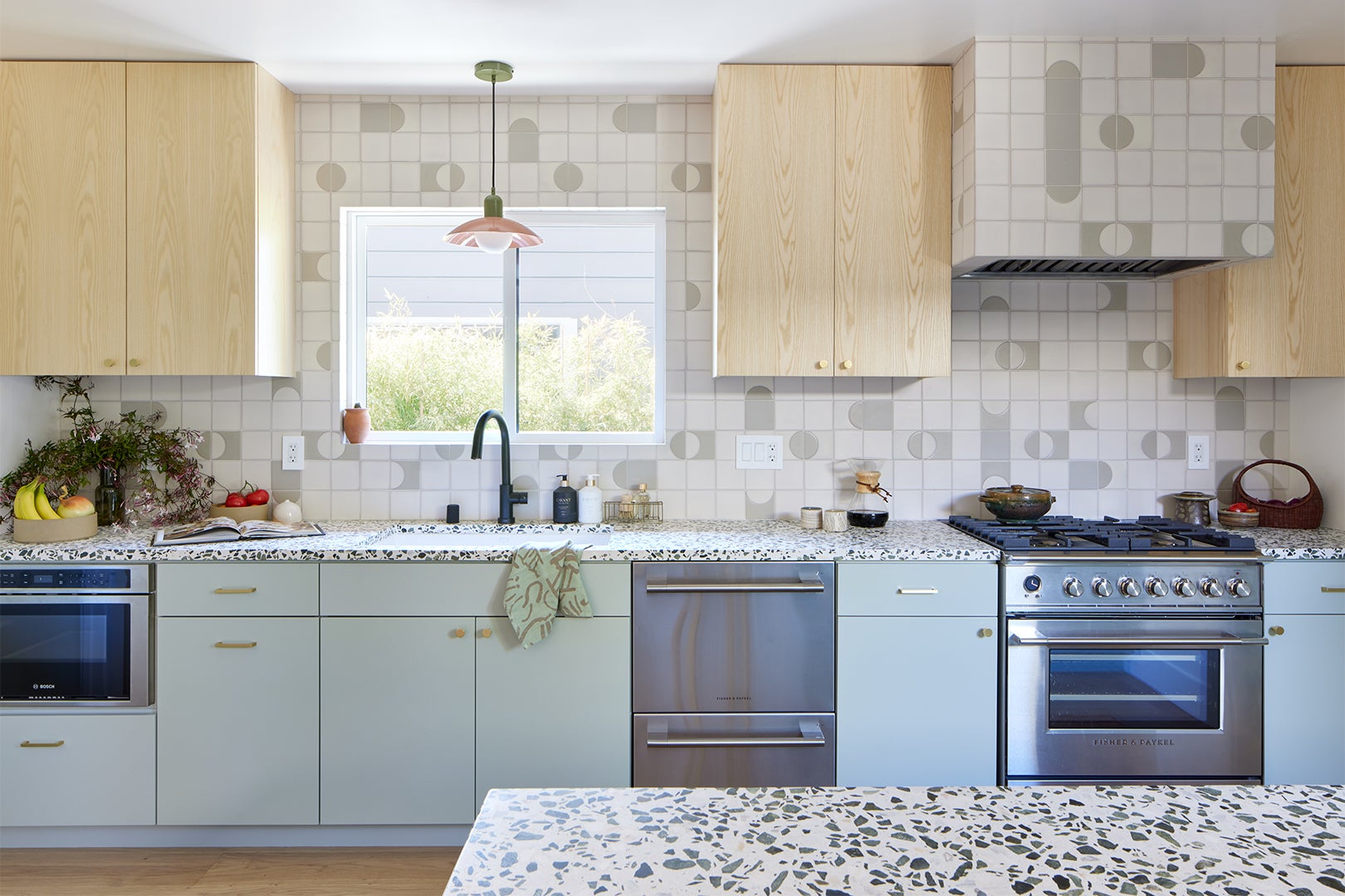 galley kitchen with graphic backsplash tile