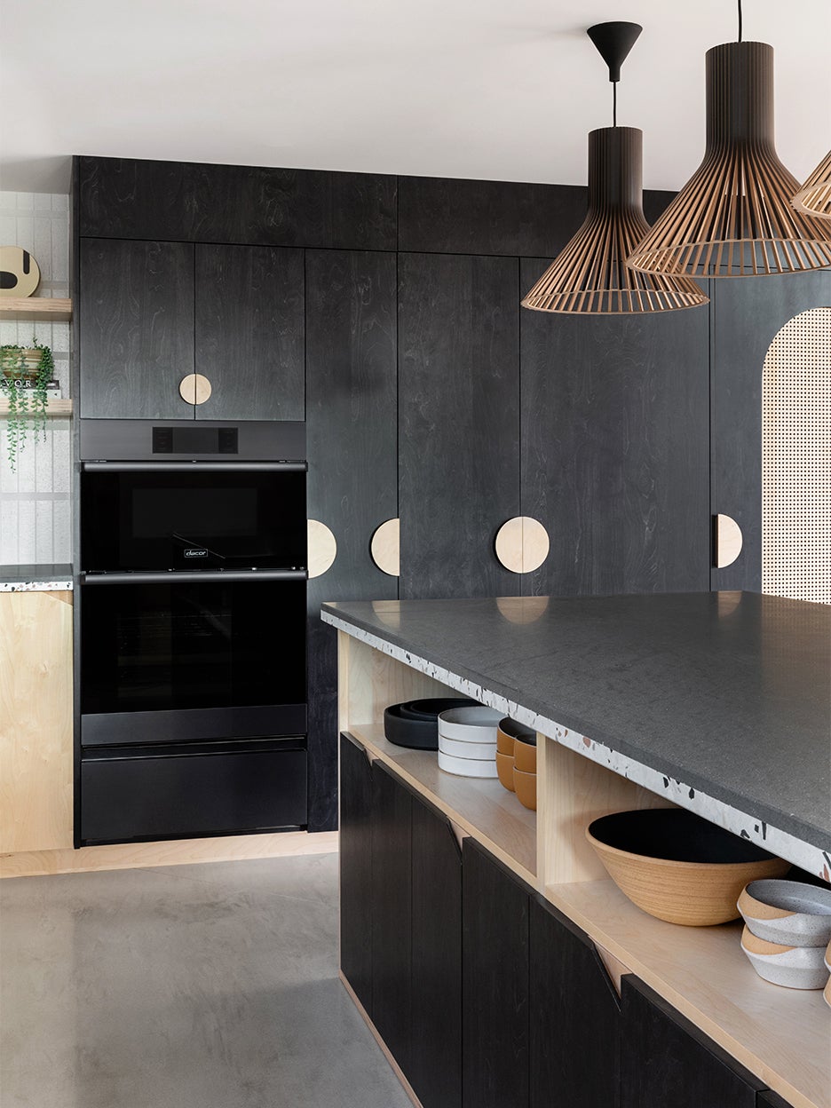 concrete floors with black cabinets