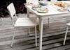 close-up of cream metal outdoor dining chair
