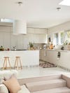 White kitchen with wooden stools