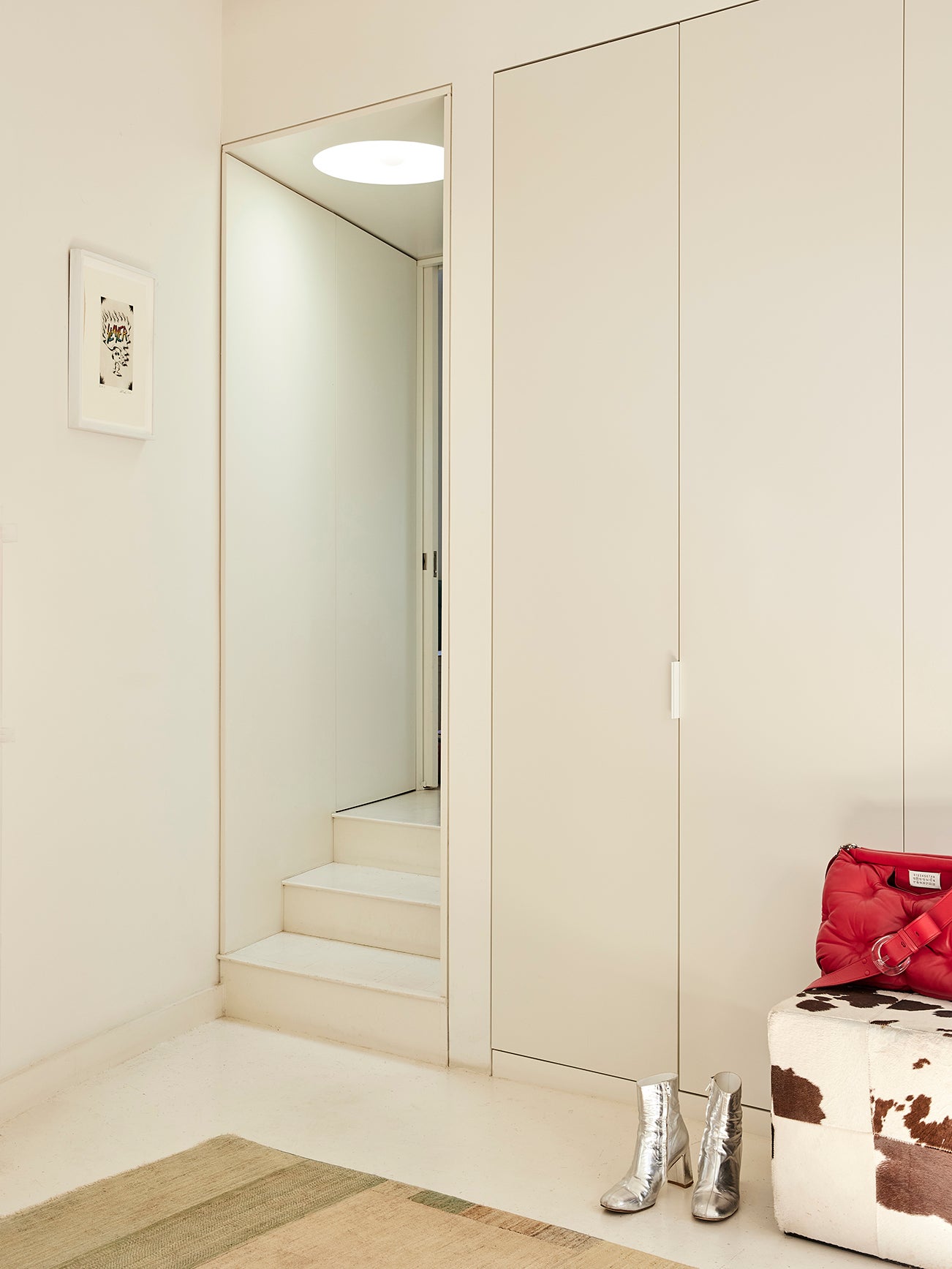 White closet doors and small staircase