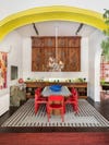 red chairs under yellow arch