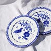 blue and white plate with bird design