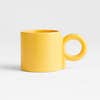 yellow coffee mug with circle handle