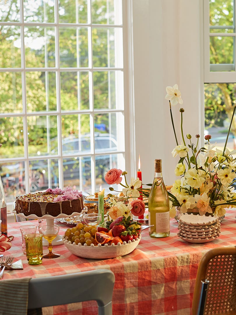 Dining table with flowers and plaid linens