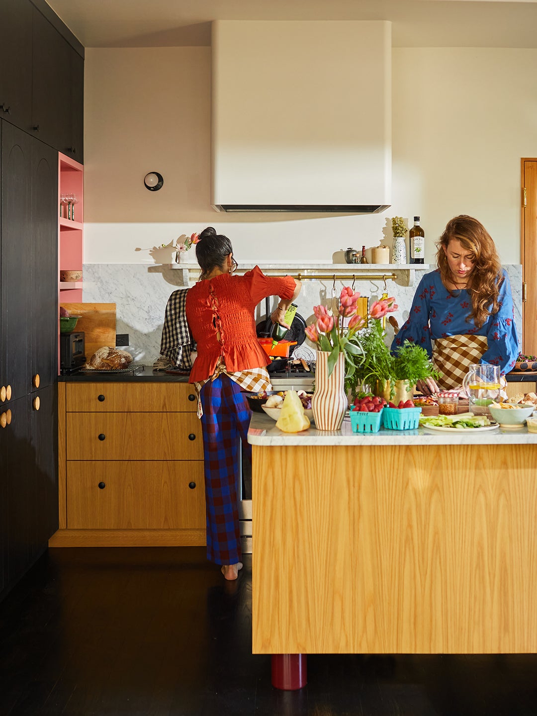 Two women prepping food in a kitchen