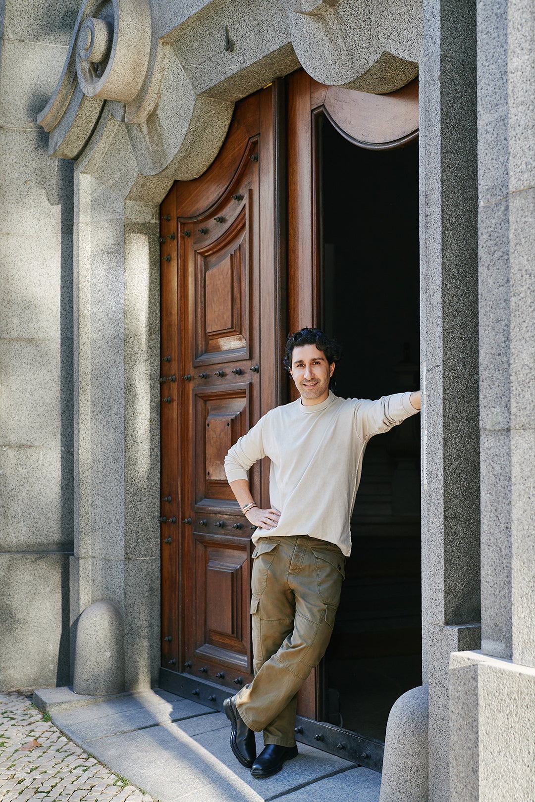 Man leaning against a doorway