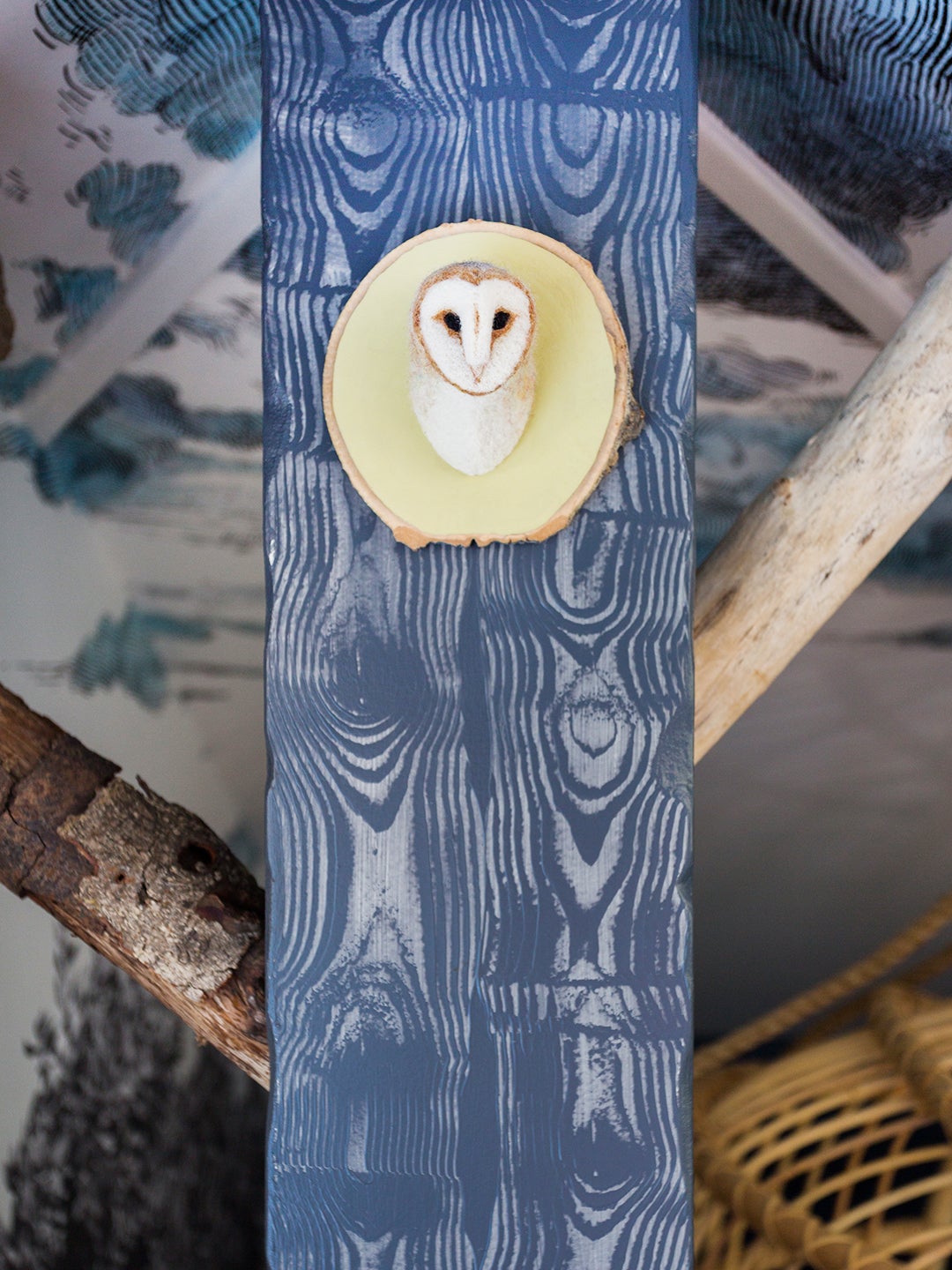 Owl art on a faux bois column